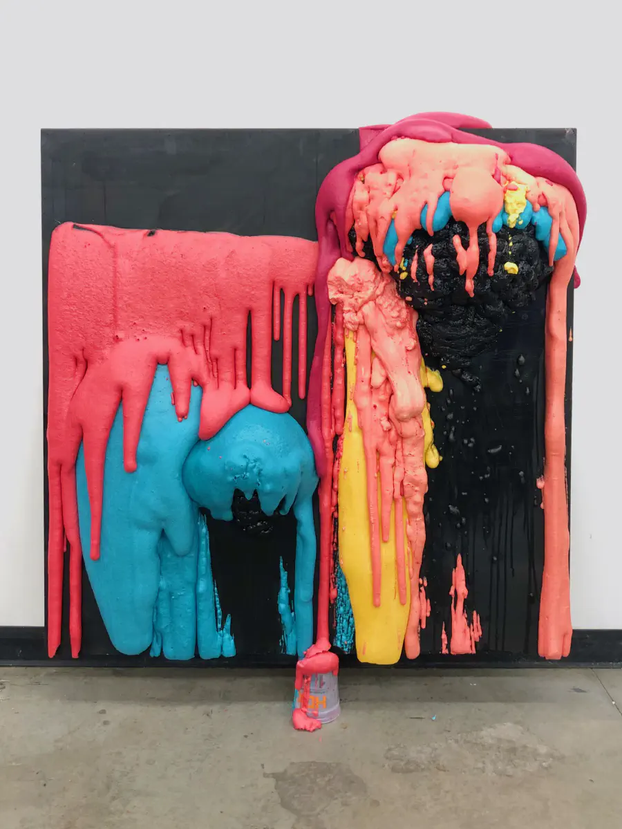 A very saturated physical monument with two figures.