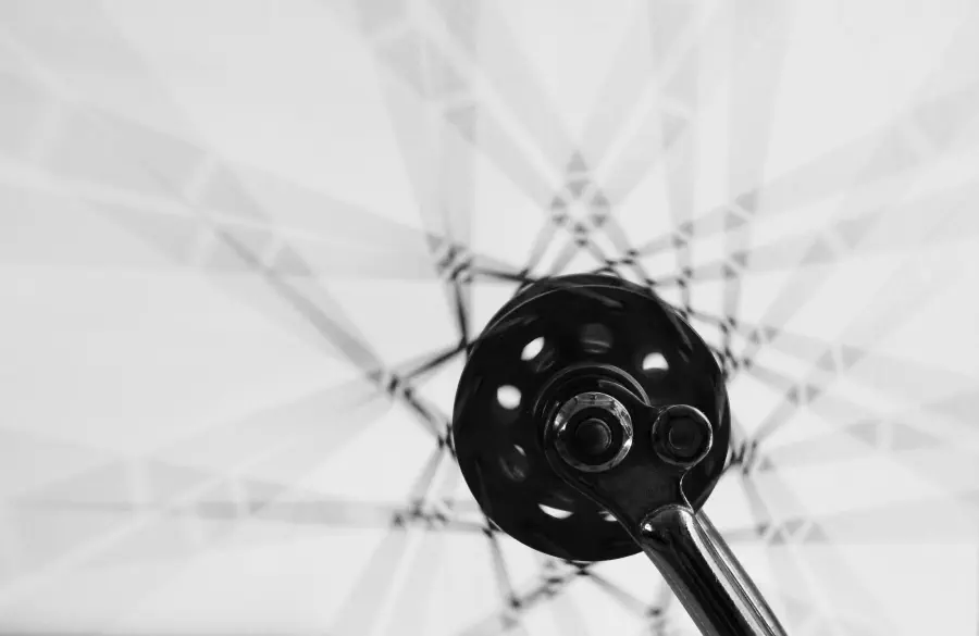 An orbiting structure captured in motion that makes a starry shape.