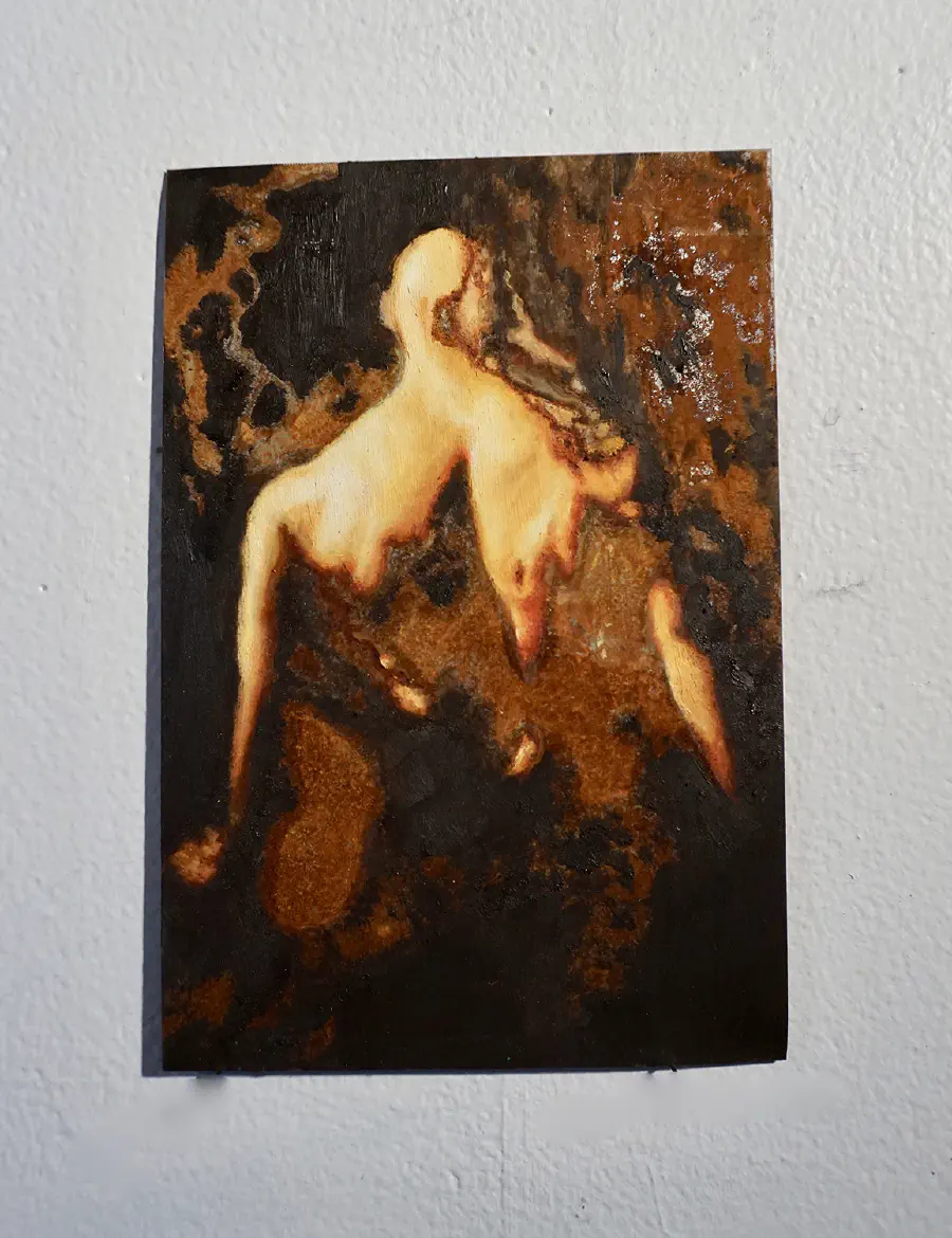 A person who appears to be melting away. The colors are tan and brown.