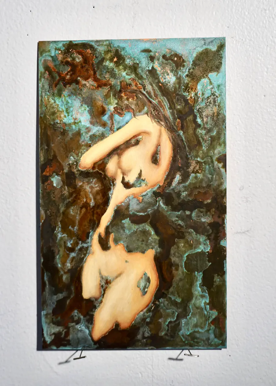 A woman whose face is either obscured or ommitted is swirled in with her abstract background, which clips through her body at times. She is nude.