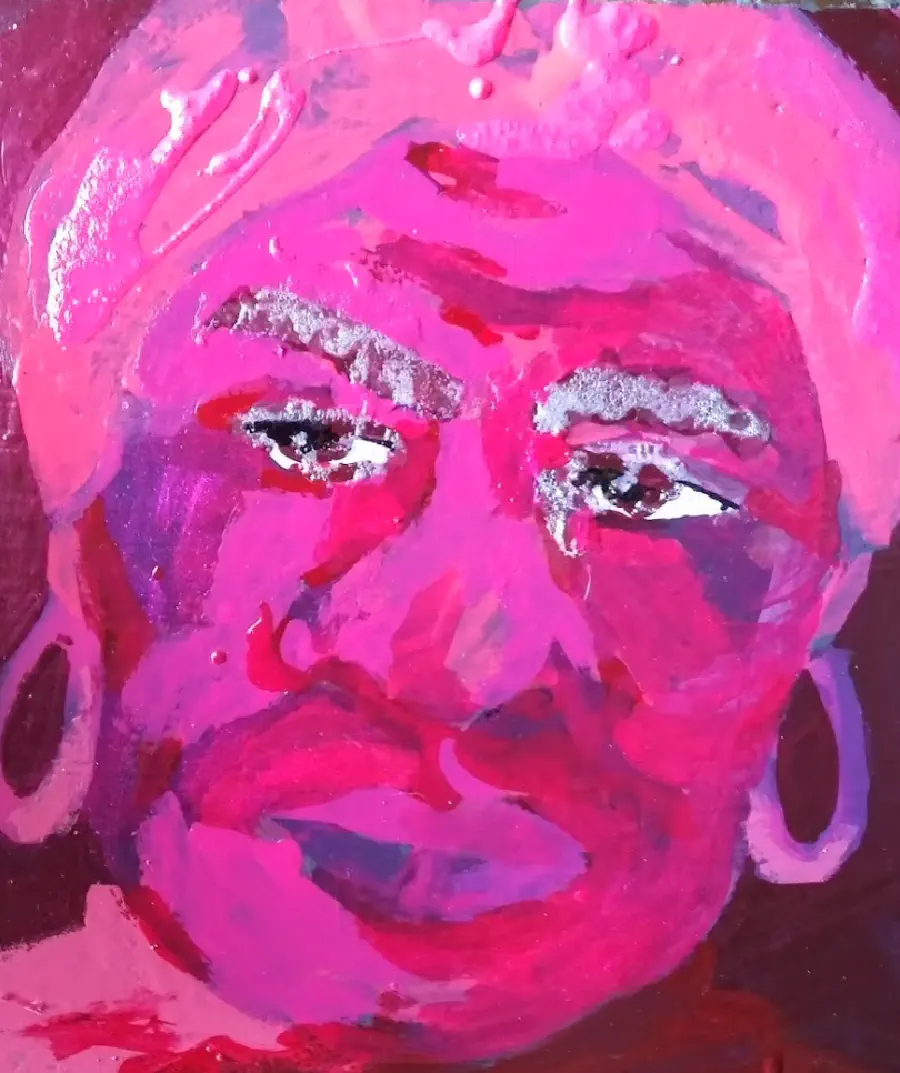 The face of a person painted in pinks and purples. The eyebrows glitter.