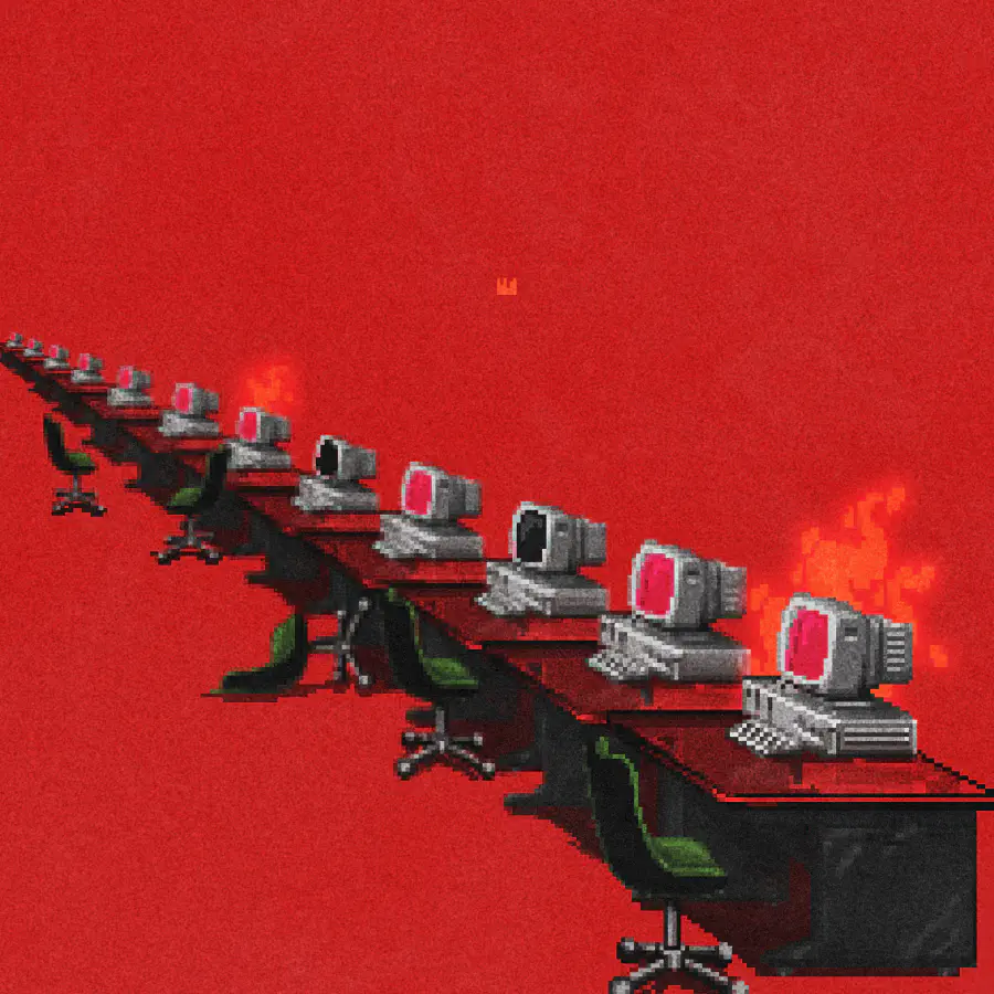 A pixel art illustration. A row of computers on desks. Some desk chairs are overturned. Some computers are on, and some are off. Two computers appear to be emanating an ominous red glow. The background is bright red.